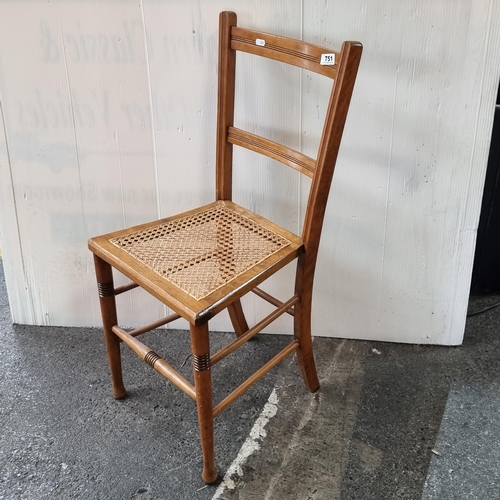 751 - A neat sized rattan seat chair with turned wooden legs. A nice, neat example.