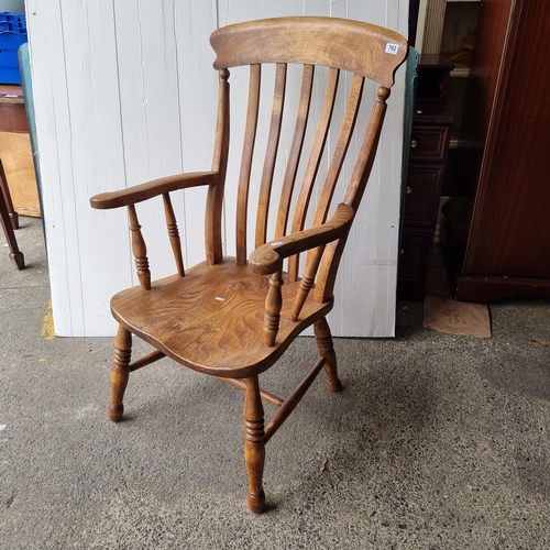 762 - A handsome antique Windsor armchair.