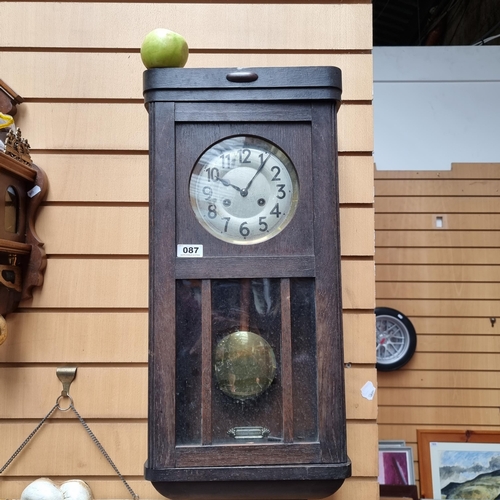 87 - Antique German wall clock in a wonderful wooden frame.