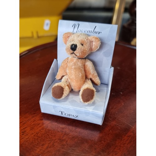 746 - A box filled with approximately 36 boxes of birthstone teddies all for November with topaz coloured ... 