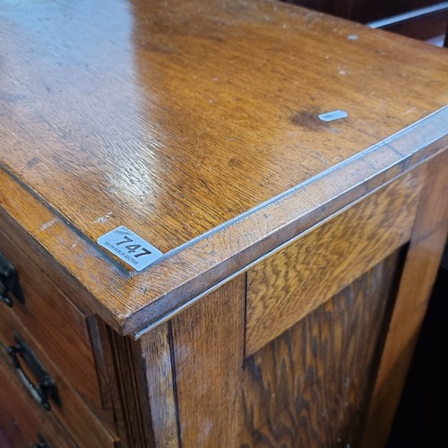 747 - A handsome antique golden oak chest with five drawers and heavy brass handles. Very nicely proportio... 