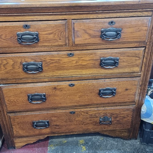 747 - A handsome antique golden oak chest with five drawers and heavy brass handles. Very nicely proportio... 