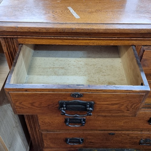 747 - A handsome antique golden oak chest with five drawers and heavy brass handles. Very nicely proportio... 