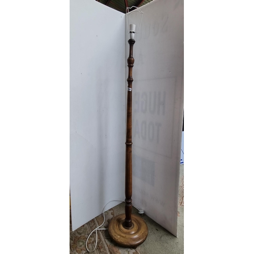 564 - A turned wooden floor lamp stand. Mm: 148cm tall.