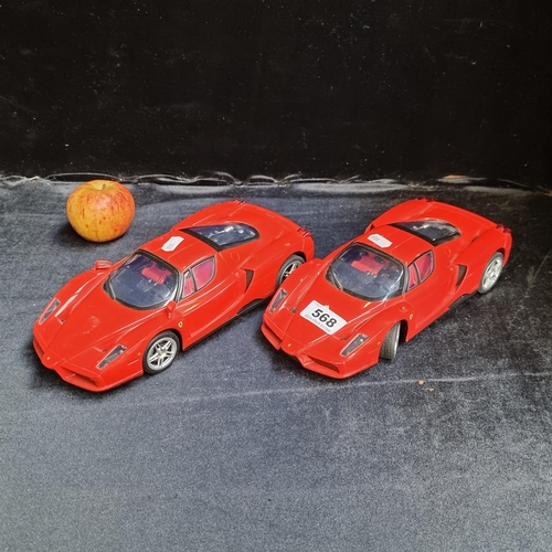 568 - Two red Silverlit 2009 Bluetooth controlled toy Ferrari cars. Model No: CP2H30E0.