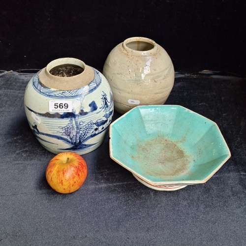 569 - Three glazed ceramic pieces including two round pots and a hand painted Chinese dish. Lots of age to... 