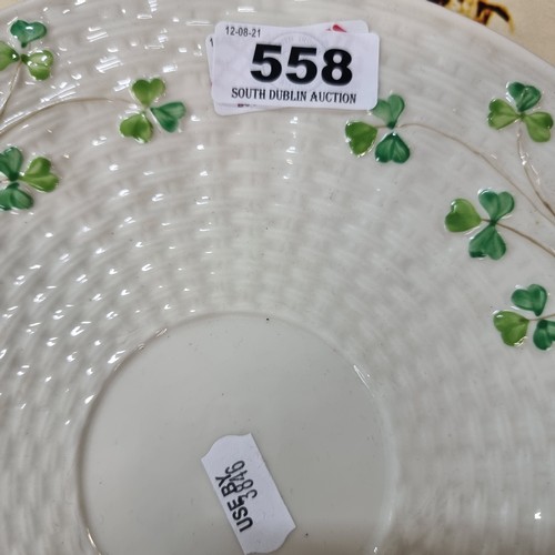 558 - A black mark  Belleek shamrock pattern decorative plate with lovely basket weave texture design.