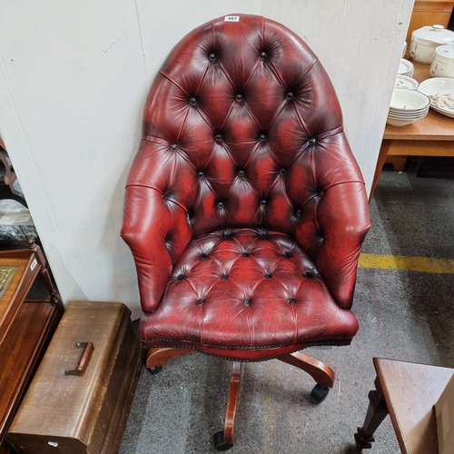 467 - Star Lot: Vintage leather swivel button-back captain's chair in oxblood.