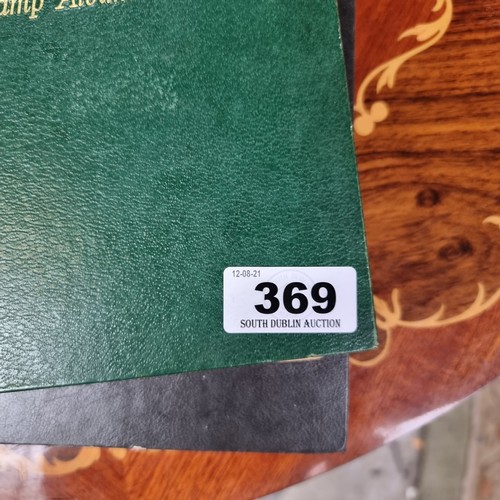 369 - A Pair of Good Stamp Albums Including a Dark Grey and Green Example.