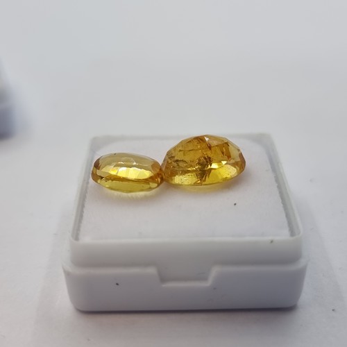 416 - A natural citrine stone, yellow in colour, weight 2.20 carats. Comes with gemstone certificate. Toge... 