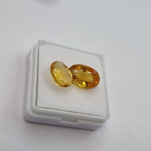 416 - A natural citrine stone, yellow in colour, weight 2.20 carats. Comes with gemstone certificate. Toge... 