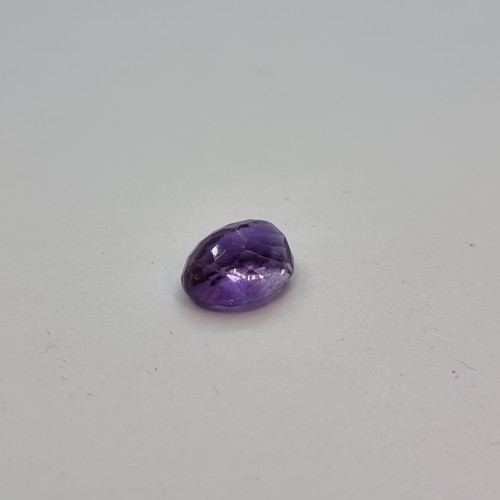 415 - A natural amethyst, weight 5.37 carats. Comes with gemstone certificate. Together with a natural sty... 