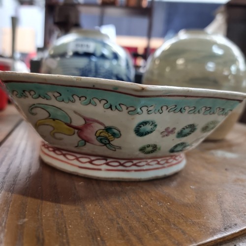 569 - Three glazed ceramic pieces including two round pots and a hand painted Chinese dish. Lots of age to... 