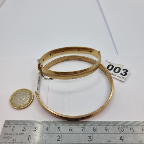 3 - A rolled rose gold bangle , dated Christmas 1924, diameter 8cm. Together with a rolled gold bracelet... 