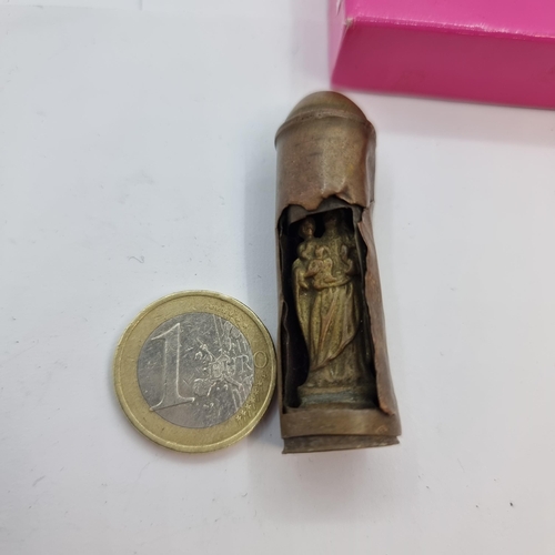 30 - An interesting example of trench art with a bullet with carved Madonna and Child figure. Height 5cm.