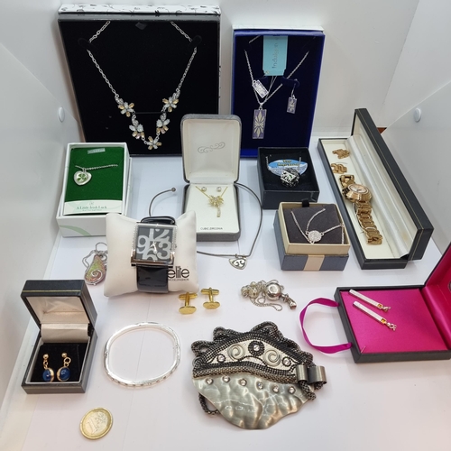 45 - Sixteen boxed items of costume jewellery, consisting of two sets of watches, matching earring and ne... 