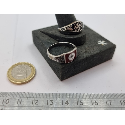 55 - Two genuine German officers WWII rings. The first with black motif, ring size Z. The second with red... 