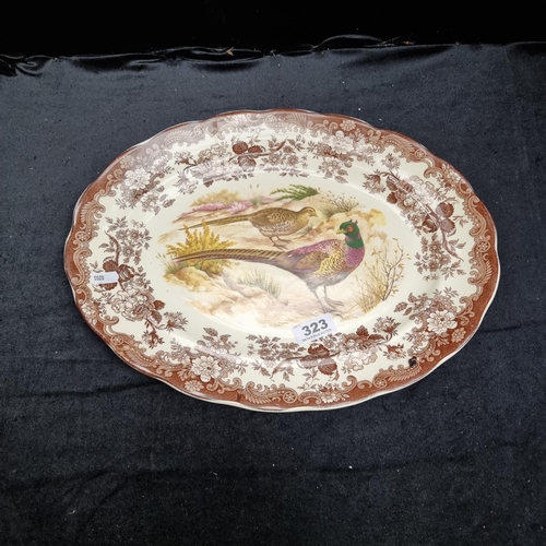 323 - A large serving platter by the Royal Worcester Group from the 