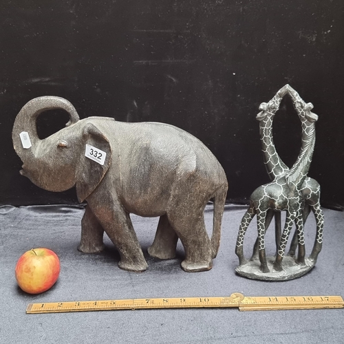 332 - Very heavy large hand carved wooden elephant and giraffe display.