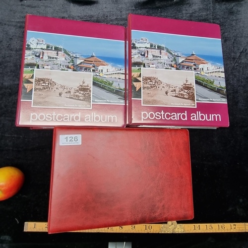 126 - Three postcard albums filled with retro postcards showing holiday destinations including Paris and I... 