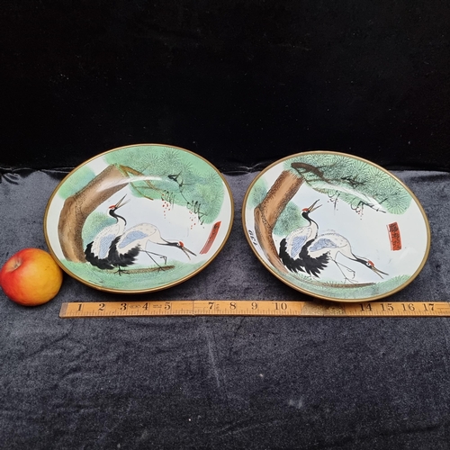 139 - Two lovely decorative hand painted Chinese bowls depicting herons, Signed by artist with unusual bra... 