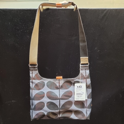 142 - Two brand new Orla Kiely items, including a Laminated Solid Stem Print Mini Sling Bag and Make-Up Ca... 