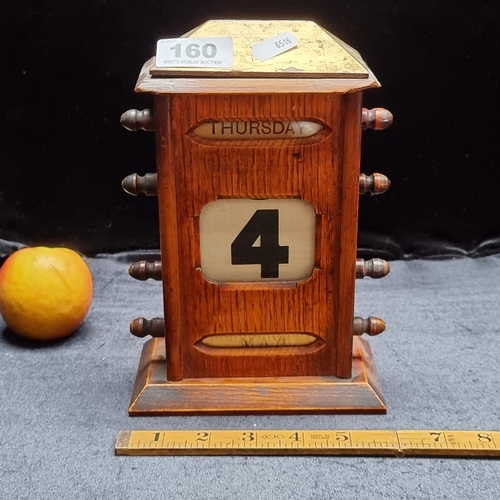 160 - A large antique wooden Perpetual desk calendar. With a brass top, Day, date and month.