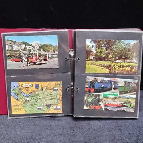 126 - Three postcard albums filled with retro postcards showing holiday destinations including Paris and I... 