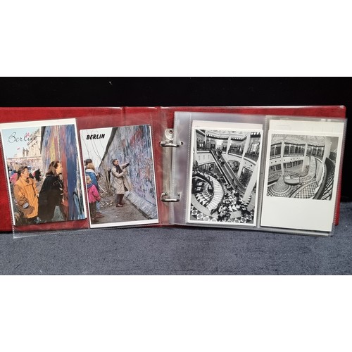 126 - Three postcard albums filled with retro postcards showing holiday destinations including Paris and I... 