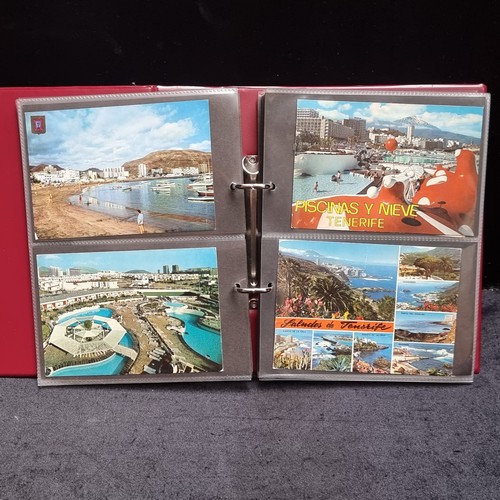 126 - Three postcard albums filled with retro postcards showing holiday destinations including Paris and I... 