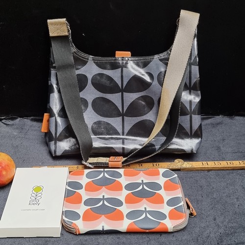 Two brand new Orla Kiely items including a Laminated Solid Stem Print Mini Sling Bag and Make Up Ca