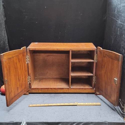 184 - A large antique, burr walnut desk tidy. Hinged doors with brass fittings and four internal shelves. ... 