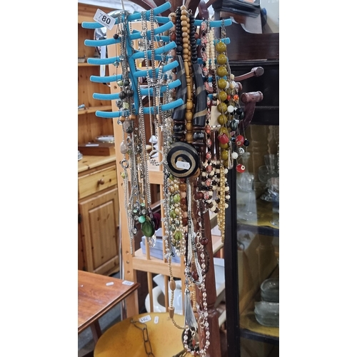 780 - A large collection of necklaces, including a very nice pendant necklace featuring marcasite and a Au... 