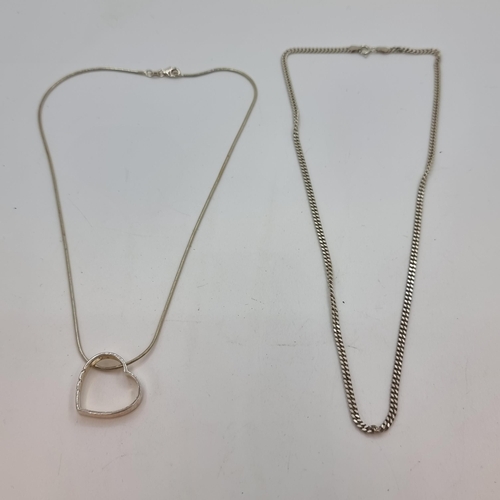 23 - Two sterling silver necklaces (stamped 925). The first with heart pendant, length 40cm. Together wit... 
