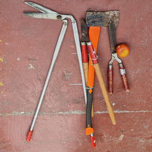 255 - Four good quality tools including an axe and edging shears.