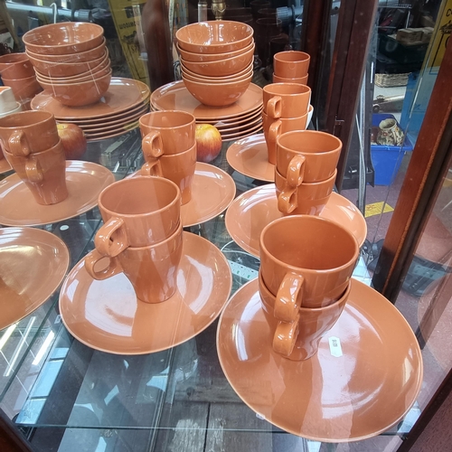 264 - 29 pieces of Ikea crockery in a burnt orange shade. With a pretty creamer jug and sugar bowl by FisU... 