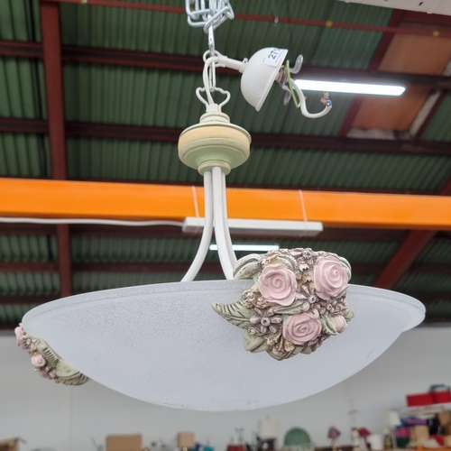 271 - A round bowl shaped frosted glass pendant ceiling light with rose adornments.