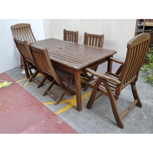 278 - Star Lot : A Bridgman Iroko outdoor dining set consisting of a table and 6 folding chairs (including... 