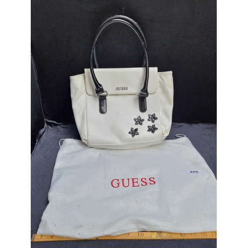 282 - Genuine leather Guess bag in white with black patent handles and applique flowers, comes in branded ... 