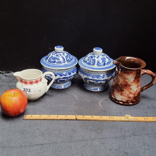 302 - Four ceramic items including two blue and white ginger jars, pot by Ewenny Pottery and a Port Merion... 