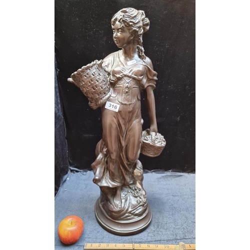 316 - Very tall Genesis-style statue of a woman carrying baskets. Mm: 69cm.