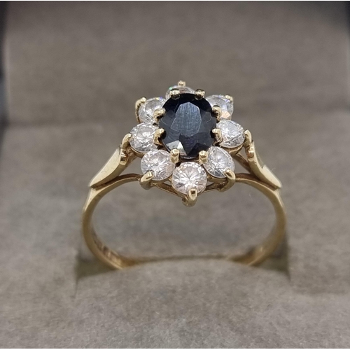 323 - Hallmarked 9 carat gold  Sapphire ring . Weight of ring 2g, size P 1/2.