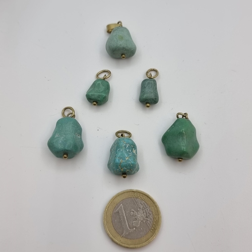 324 - Six turquoise pendants of assorted sizes, marked 8 carat gold, stamped 333.