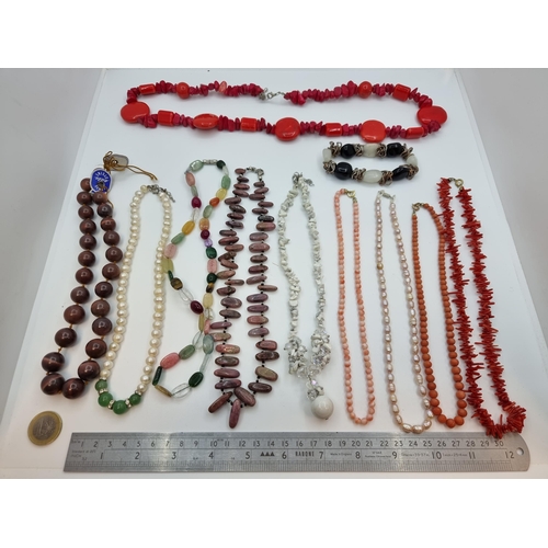 331 - A large bag of natural stone costume jewellery, featuring coral necklaces. Nice dealer lot.