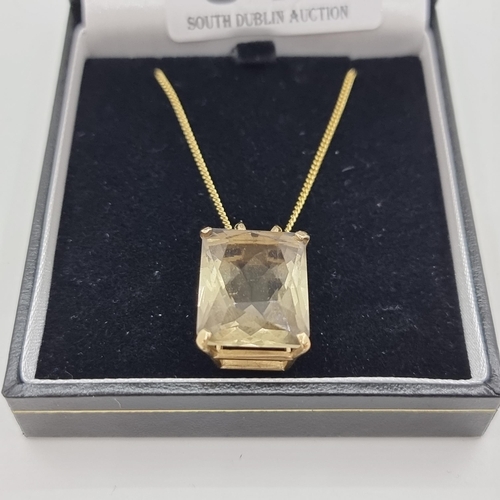 341 - Star Lot : A 9 carat gold large citrine stone pendant, together with a 9 carat gold chain (length 48... 