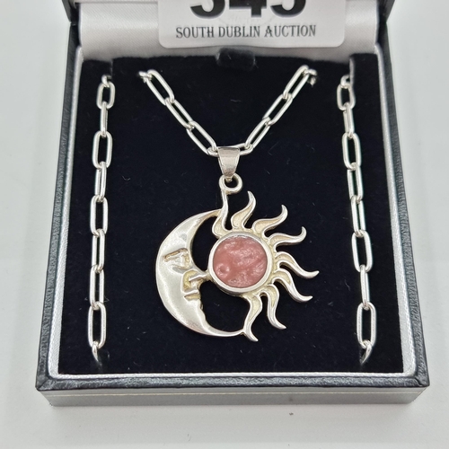 345 - A sterling silver (stamped 925) necklace with sun and moon pendant. Length of chain 54cm.