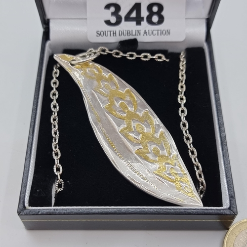 348 - A  Sterling silver gilt leaf design pendant, length of pendant 8cm. Total weight 27.4g.