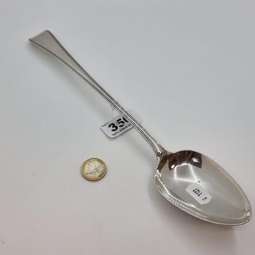 350 - Star Lot : A very large,  very fine example of a Georgian basting spoon with fiddle designed termina... 