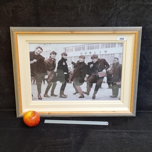 58 - Good sized print showing the Beatles outside the old Dublin Airport. Great iconic shot.