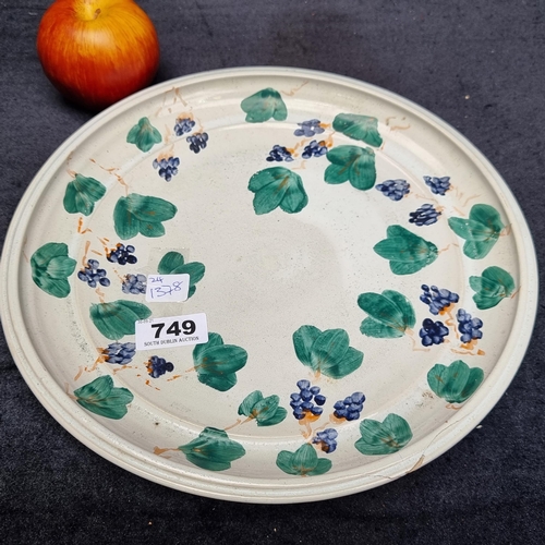 749 - Large hand painted dish by Moville Ireland 'Art Desire', signed. In grape vine pattern.